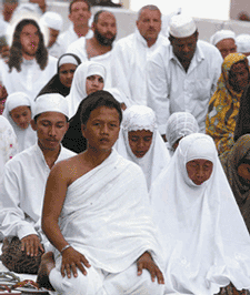 Above: Christ (uppermost left) joins fellow Muslims in prayer.