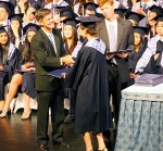 Mr. Carr (the head of school) confers the diploma